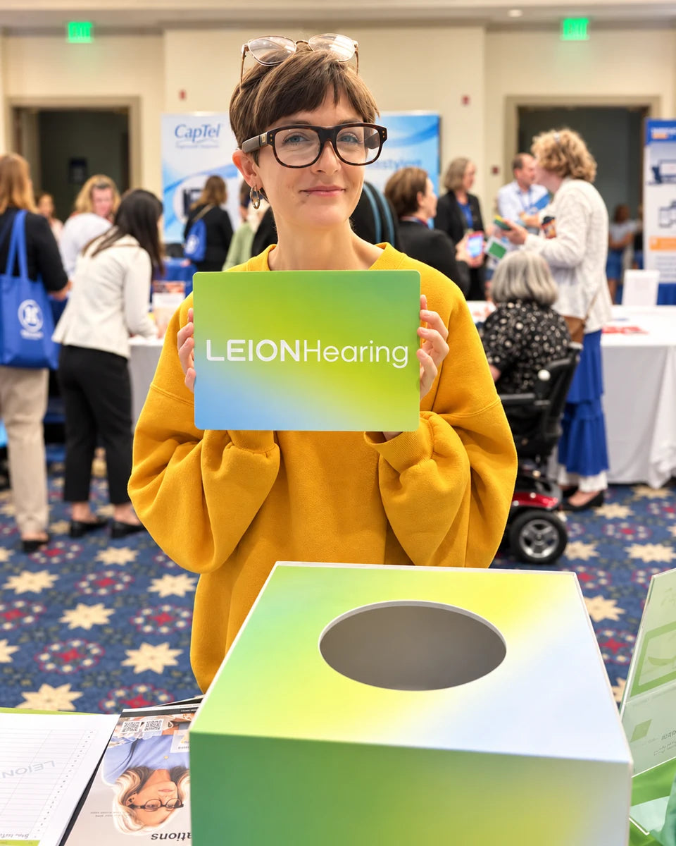 Attendee trying LEION Hearing glasses at ALDAcon 2026